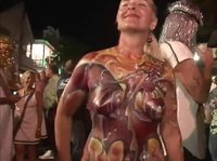 Topless milfs have fun at the body paint party